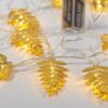 ΣΕΙΡΑ, 10 LED 5mm, ΜΕΤΑΛΛΙΚΑ ΧΡΥΣΑ ΦΥΛΛΑ 6cm, ΜΠΑΤΑΡΙΑΣ 2xAA, ΧΡΟΝΟΔΙΑΚΟΠΤΗ, ΔΙΑΦΑΝΟ PVC ΚΑΛΩΔΙΟ, ΘΕΡΜΟ ΛΕΥΚΟ LED ΑΝΑ 10cm, ΠΡΟΕΚΤΑΣΗ ΠΑΡΟΧΗΣ 50cm, IP20